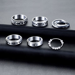 MUCAL fidget rings set featuring beads and moon-star elements.