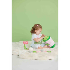 Mud Pie Pink Golf Plush Set rattle ball for sensory exploration during play.