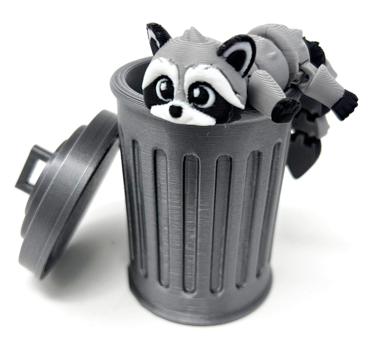 MunnyGrubbers raccoon with trashcan posing on desk for stress relief and focus