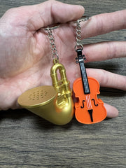 MunnyGrubbers trombone keychain on desk evokes humorous moments.