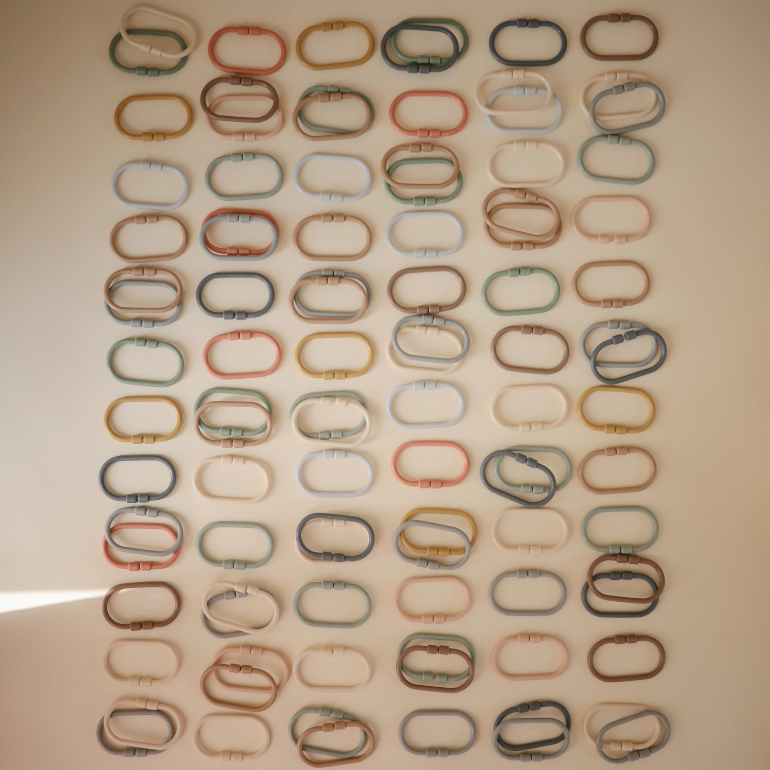 Lightweight, smooth links invite grasping and exploration by little hands.