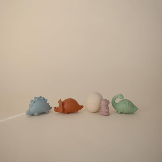 Mushie dino egg bath toy featuring a baby dino for curious discovery