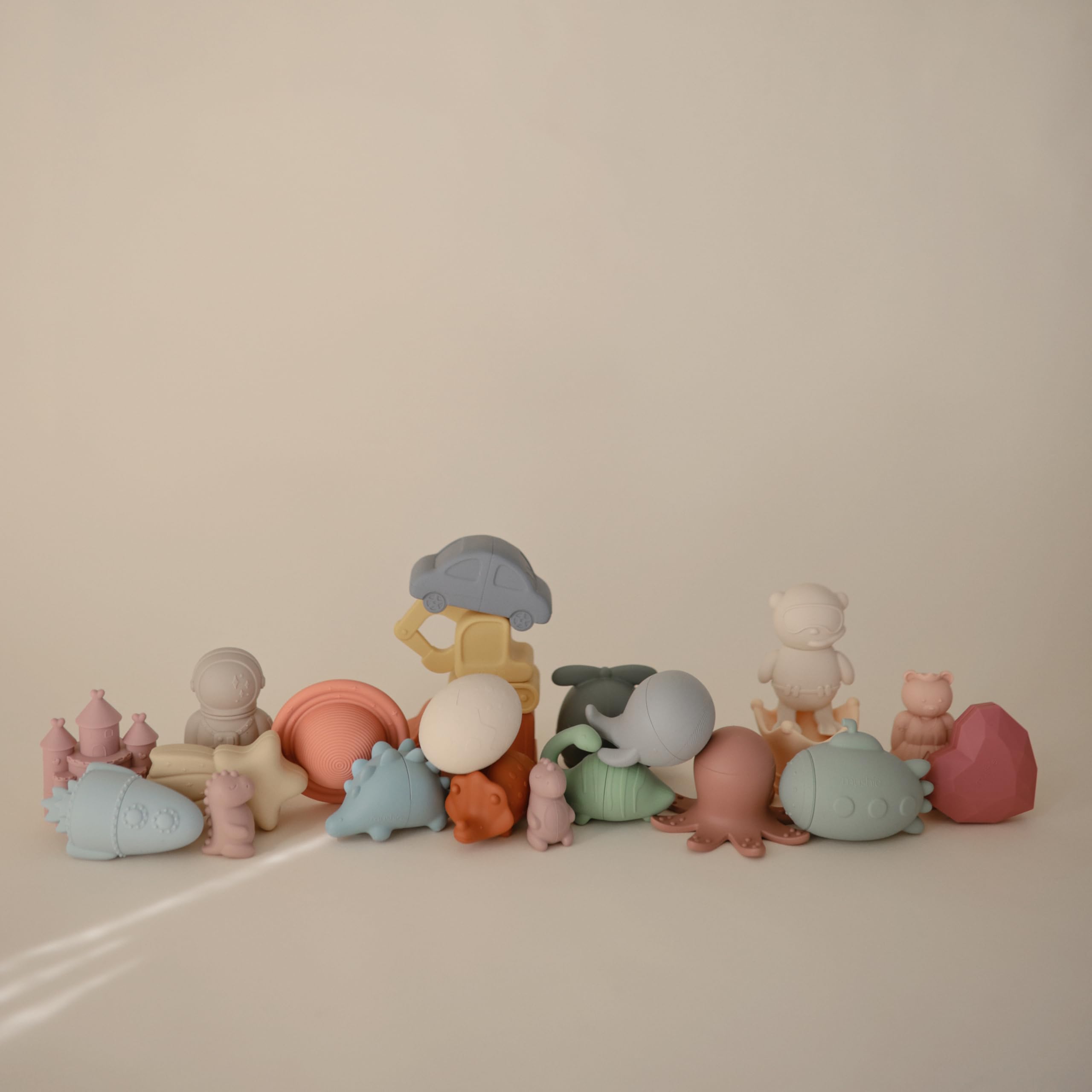 Mushie Dino Bath Toy opens into two pieces for easy cleaning