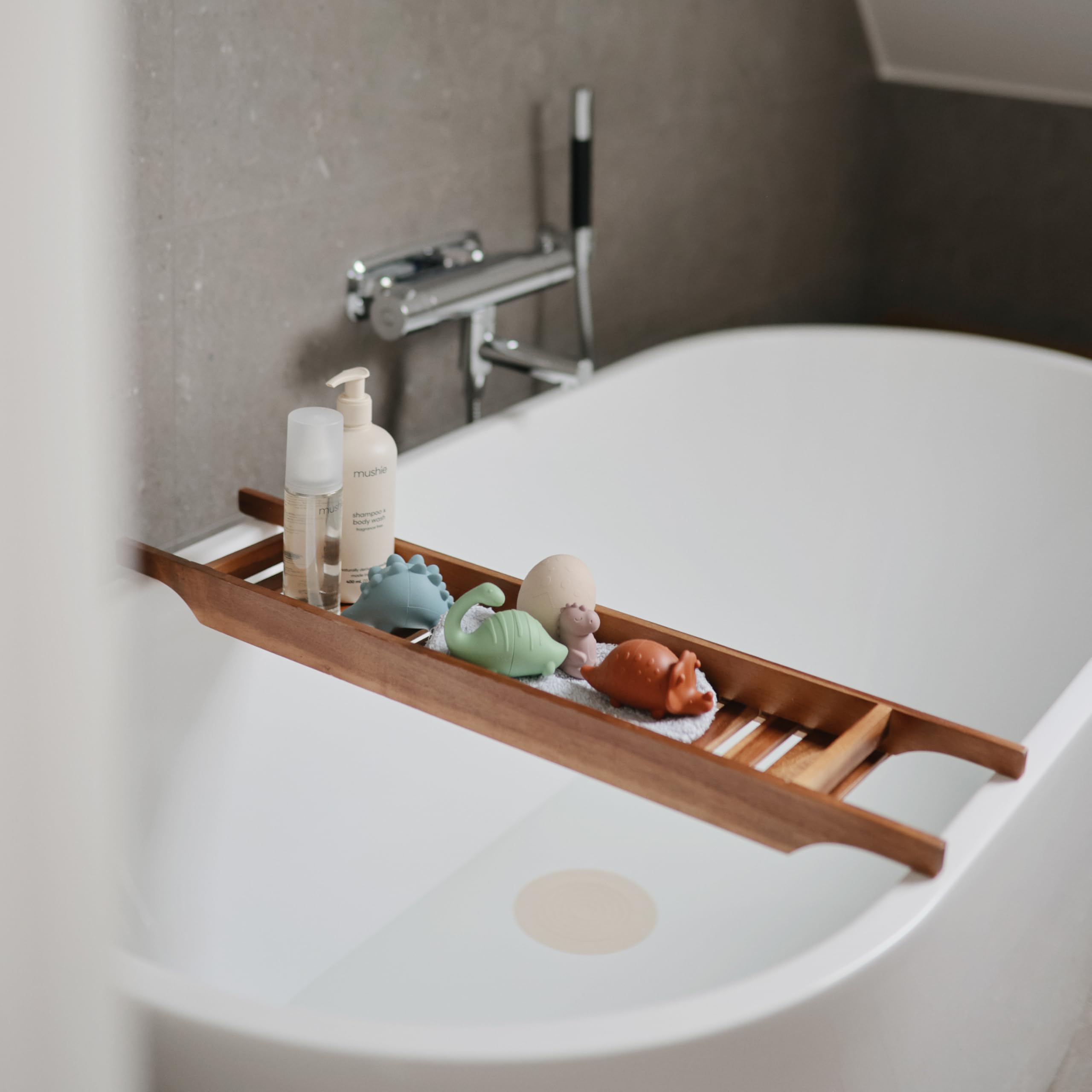 Mushie Dino Bath Toy in soft silicone for gentle handfeel