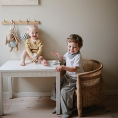 Mushie HexaPop suction toy attached to a highchair for easy access