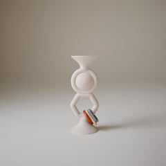 Mushie HexaPop suction toy on a smooth bottom surface for portable entertaining