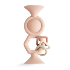 Mushie HexaPop suction toy with dual top cups for secure play on a smooth surface