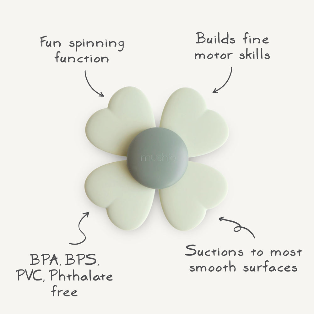 Mushie Lucky Suction Spinner Toy on a high chair promotes independent play.