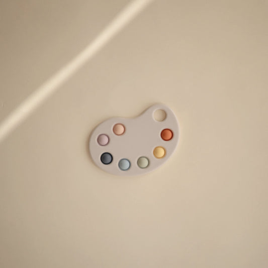Mushie Paint Palette Press Toy bubbles close-up highlights gentle pop for focus
