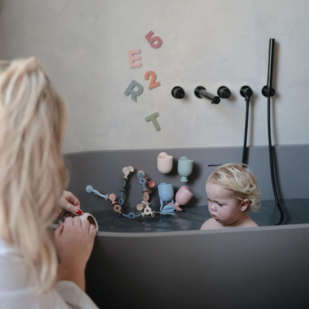Mushie compact bath toy fits little hands