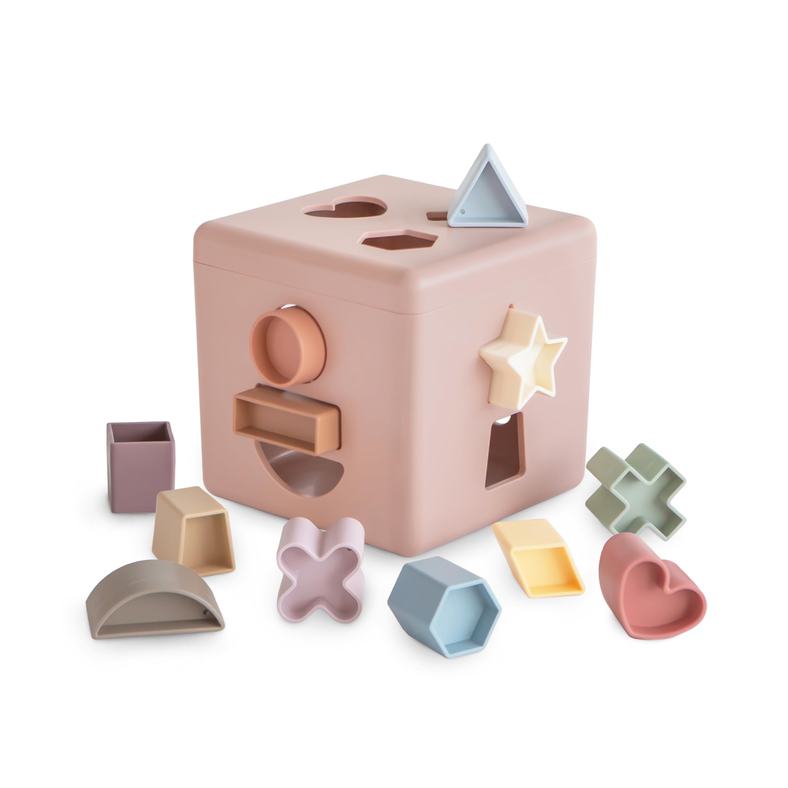 Mushie Shape Sorting Box Petal with lid open promotes early shape exploration.