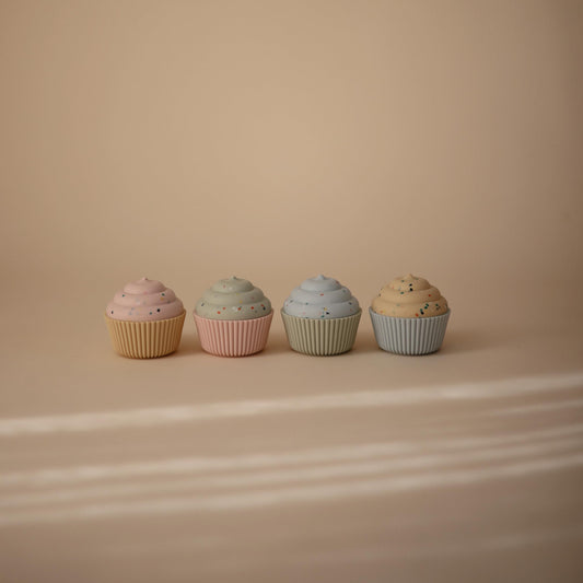 Mushie cupcake toy 4-pack with soft textures for soothing exploration.
