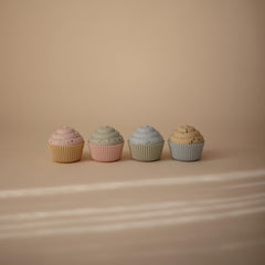 Mushie cupcake toy 4-pack with soft textures for soothing exploration.