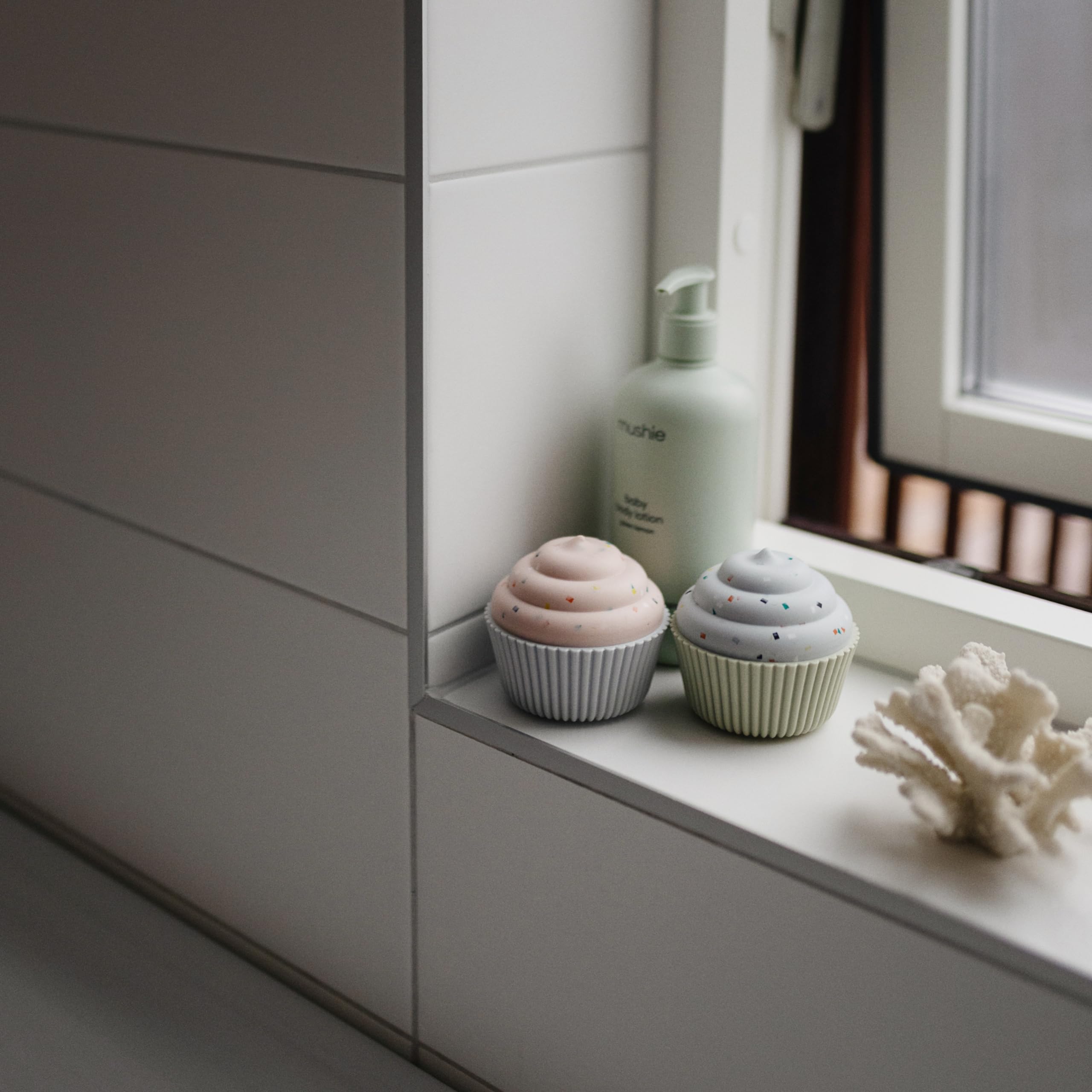 Mushie silicone cupcakes 4-pack that stack neatly for organized play.