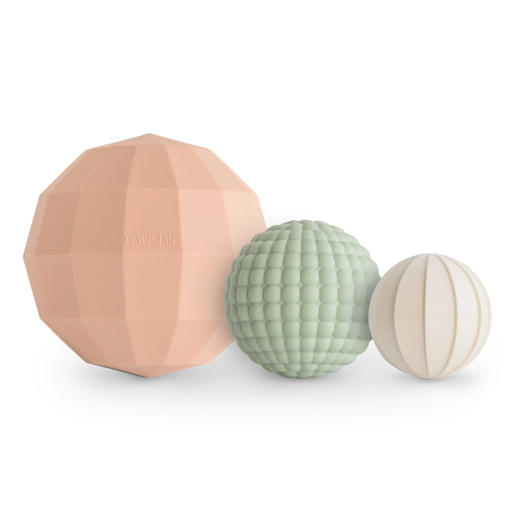 Mushie silicone nesting spheres blush pack-3 for soothing tactile play.