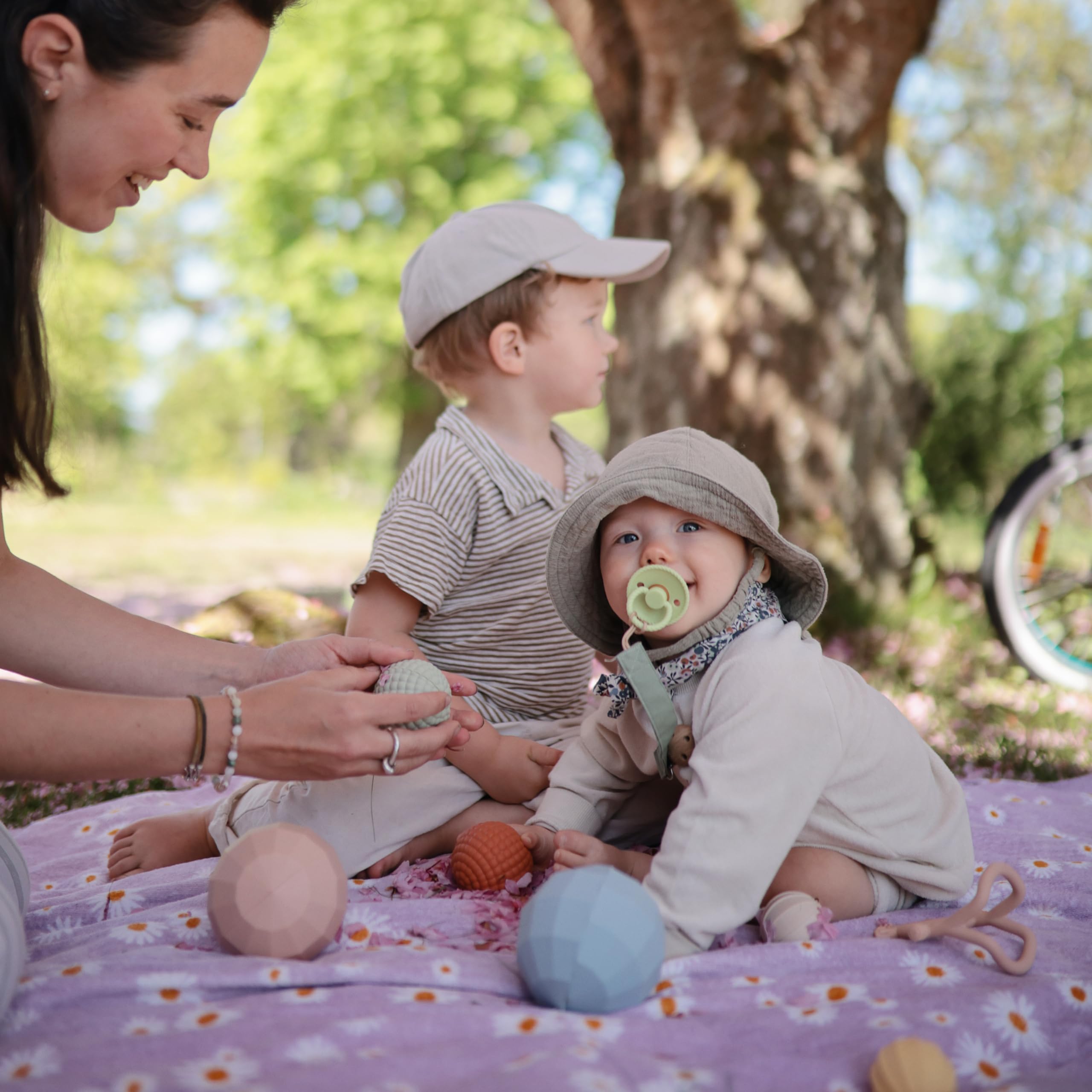 Mushie silicone nesting-spheres blush care-wipe-clean for easy sanitizing.