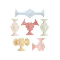 Mushie silicone suction builder daisy pieces ready for creative play and tidy storage.