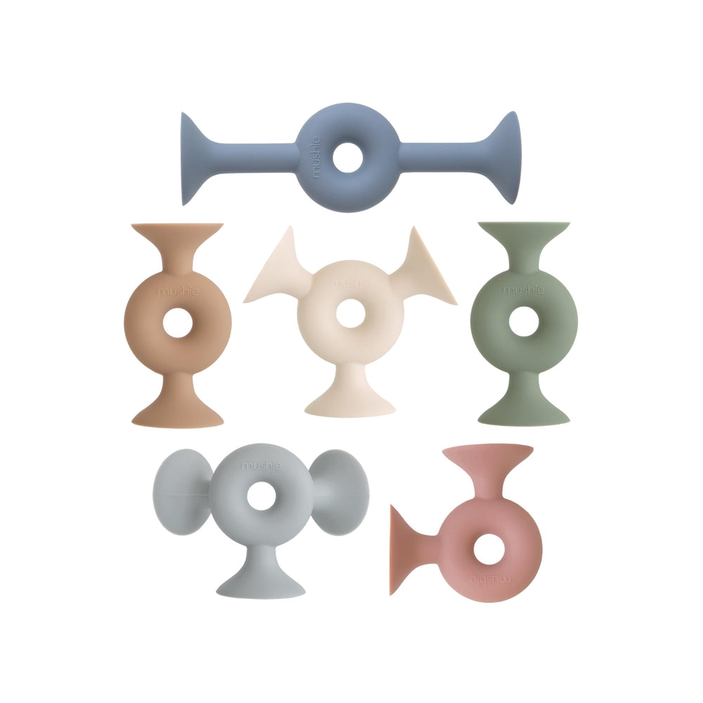 Mushie silicone suction builder donut pieces ready for creative assembly.