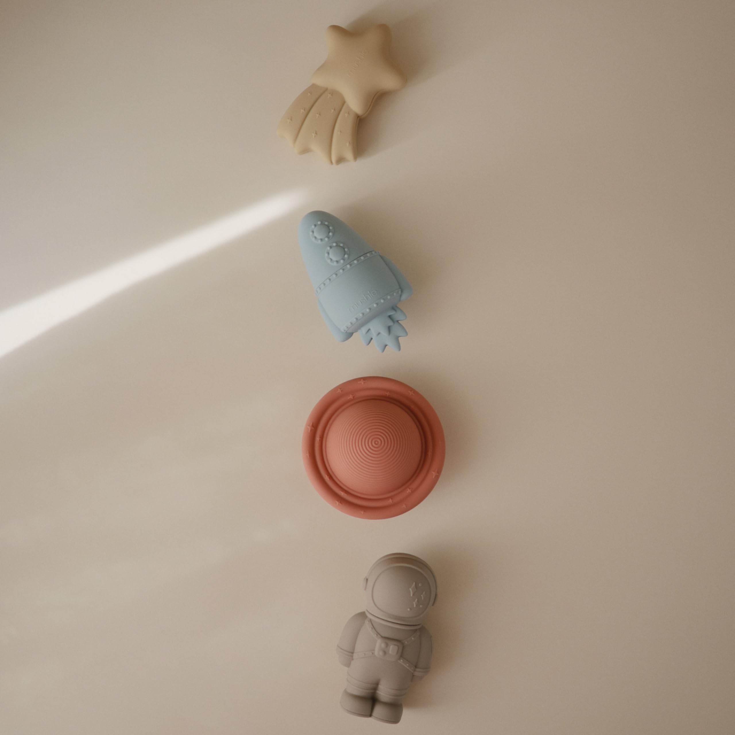 Mushie Space Bath Toy rocket with two-piece design for easy cleaning.