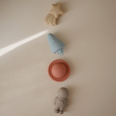 Mushie Space Bath Toy rocket with two-piece design for easy cleaning.