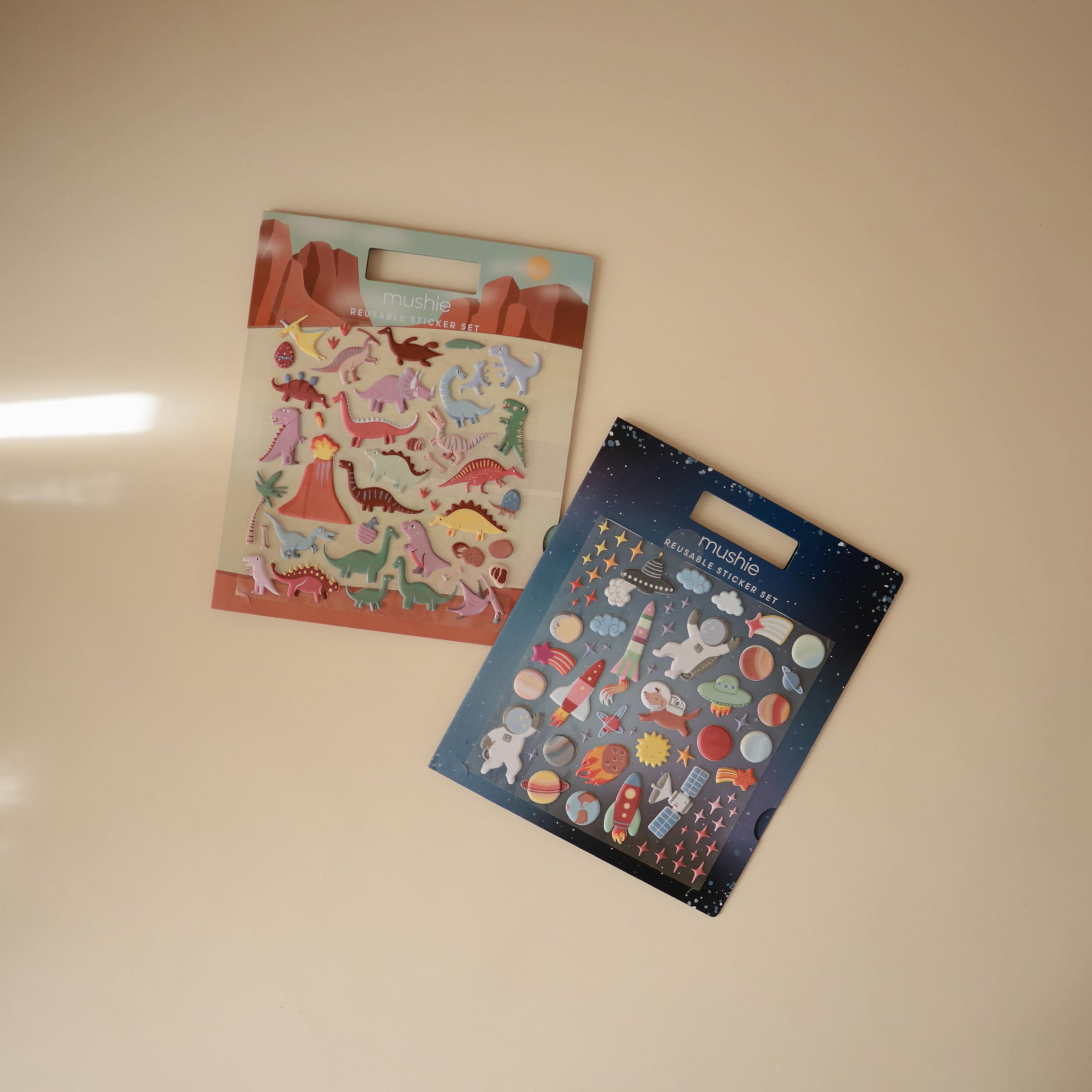 Mushie Space sticker book backs wipe clean for simple care.