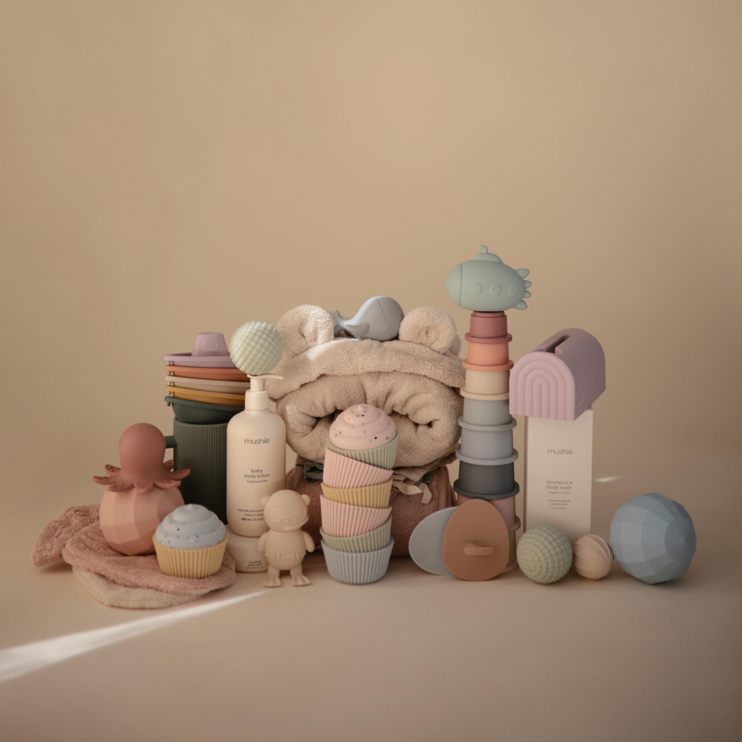 Mushie Petal boats connect to teach colors and counting during bath time.