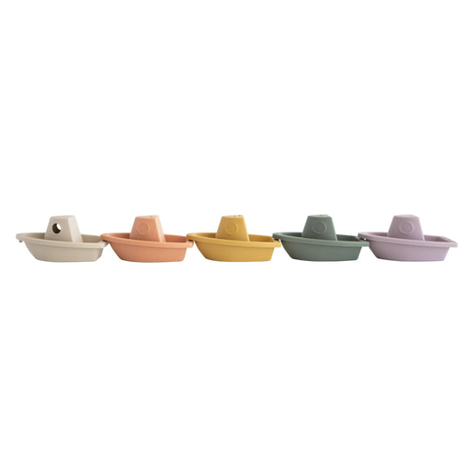 Five linked Mushie bath boats forming a floating train for imaginative play