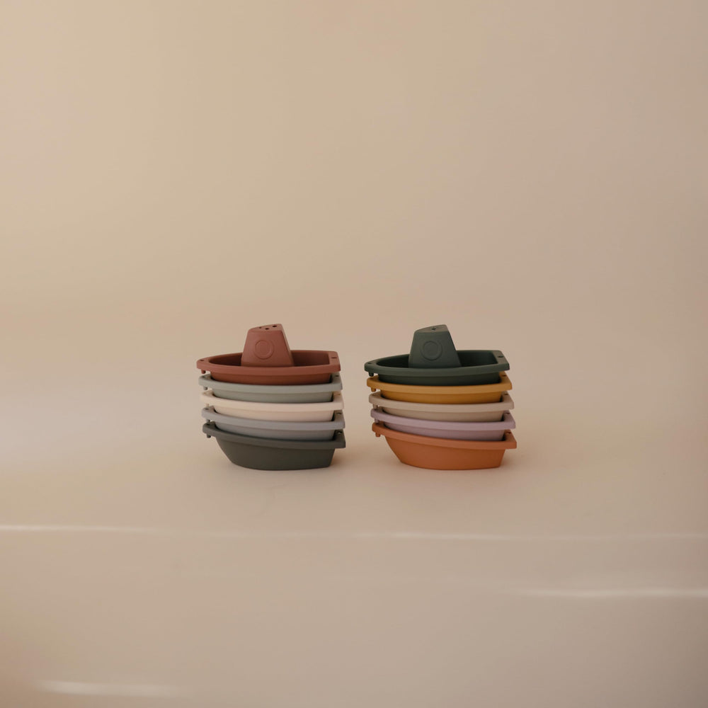 Stackable Mushie bath boats stored neatly after bath time