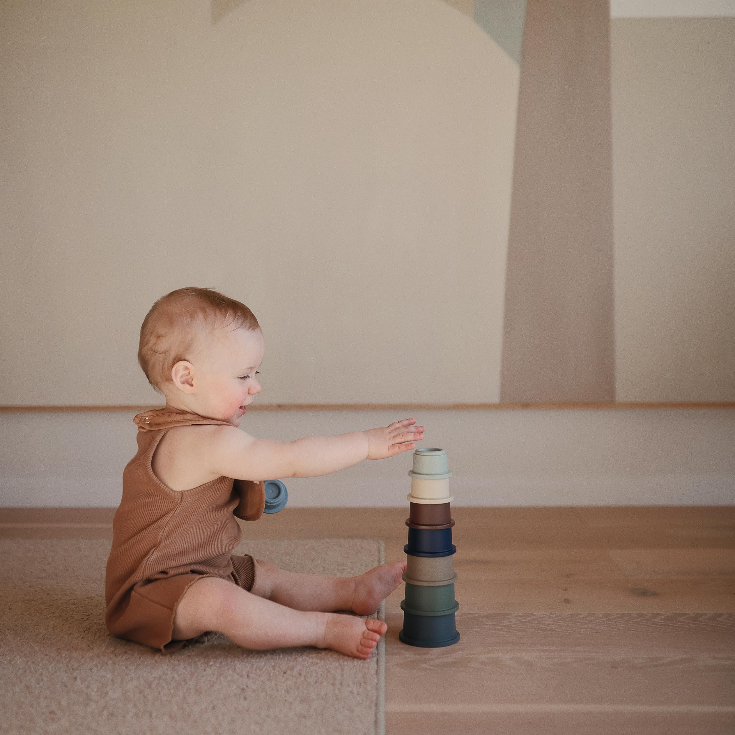 Mushie forest stacking cups color palette with forest-inspired pieces for color play.