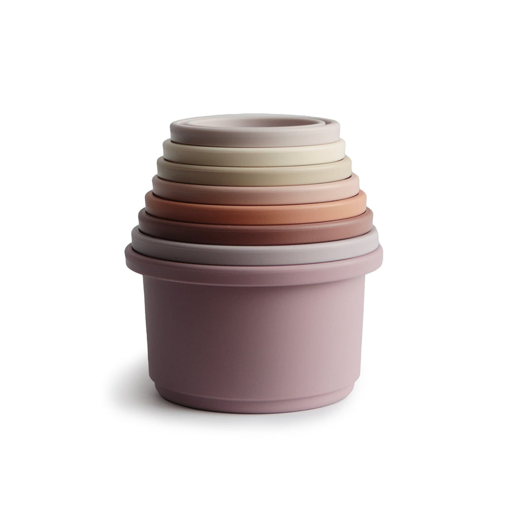 Mushie Stacking Cups Petal set shown in nested tower for easy storage and play.