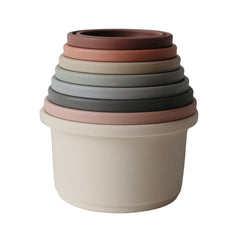 Mushie stacking cups support fine motor skills during safe, engaging stacking sessions.