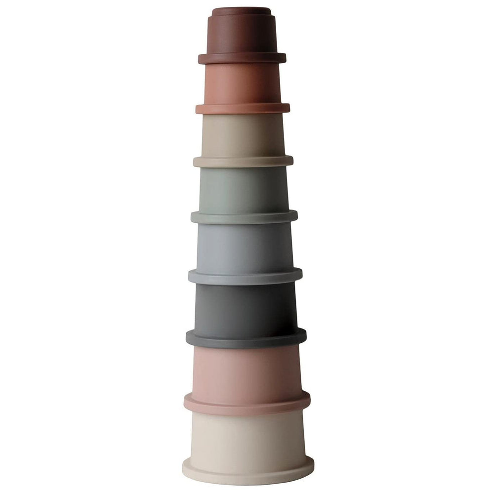 Mushie Stacking Cups Toy round tower visual enhances early spatial play and color recognition.
