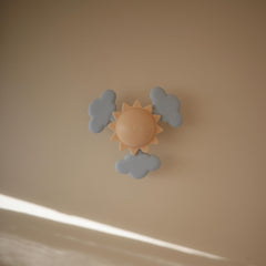 Mushie Sunshine soft silicone clouds spinning for tactile exploration