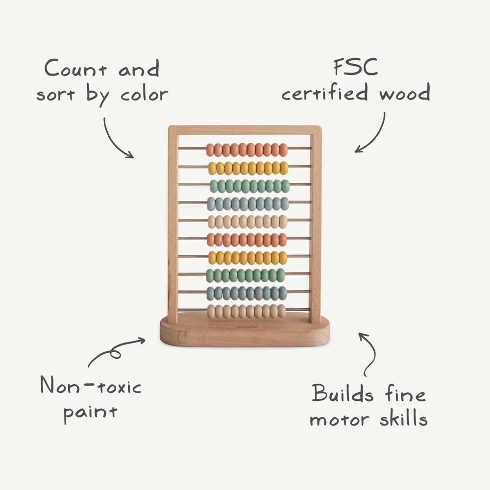 Mushie wooden abacus frame in natural wood for calm nursery decor