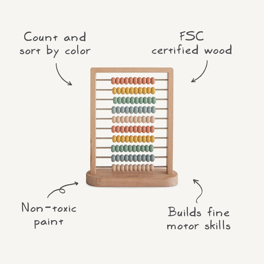 Mushie wooden abacus frame in natural wood for calm nursery decor