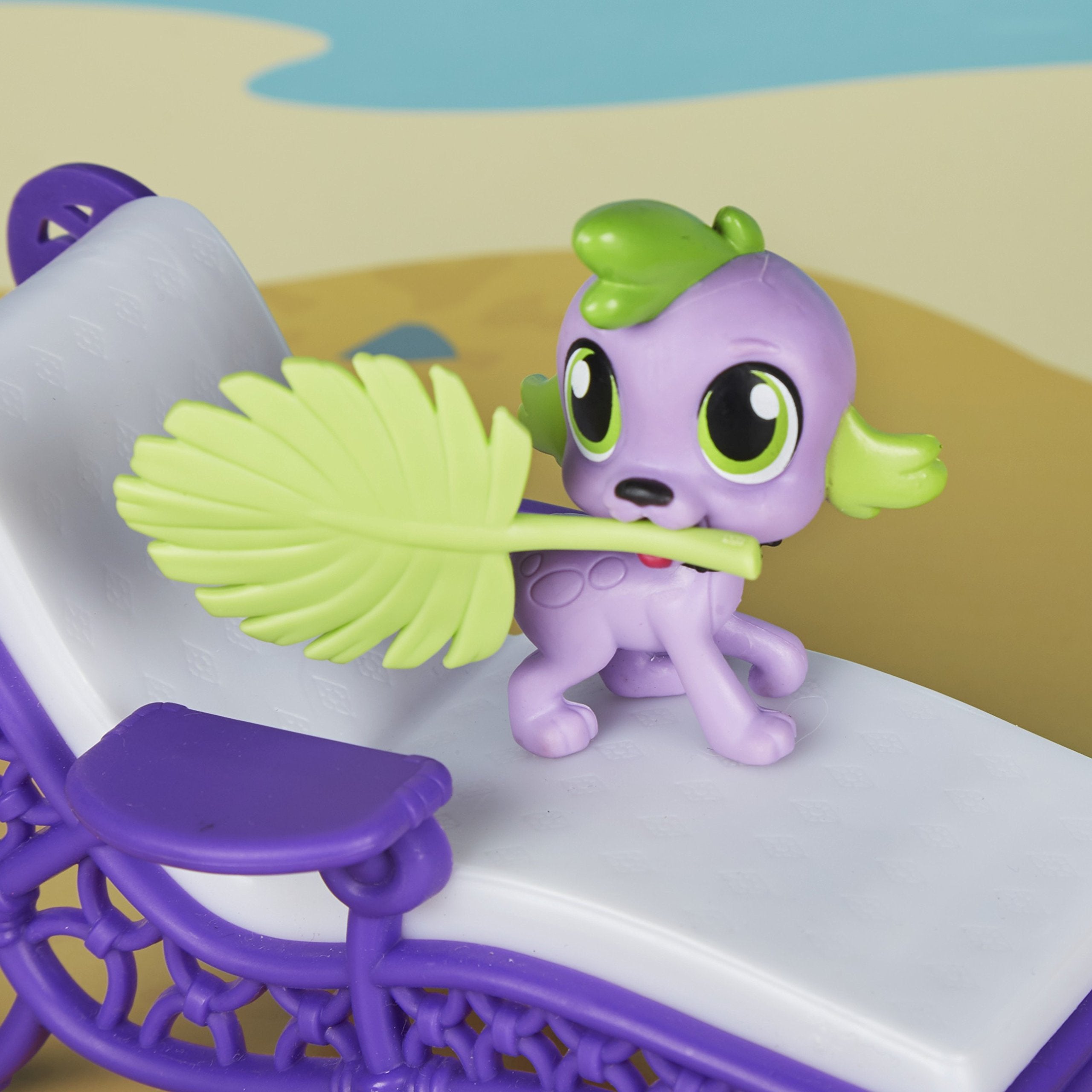 My Little Pony leaf fan fits Spike's mouth for playful interaction.