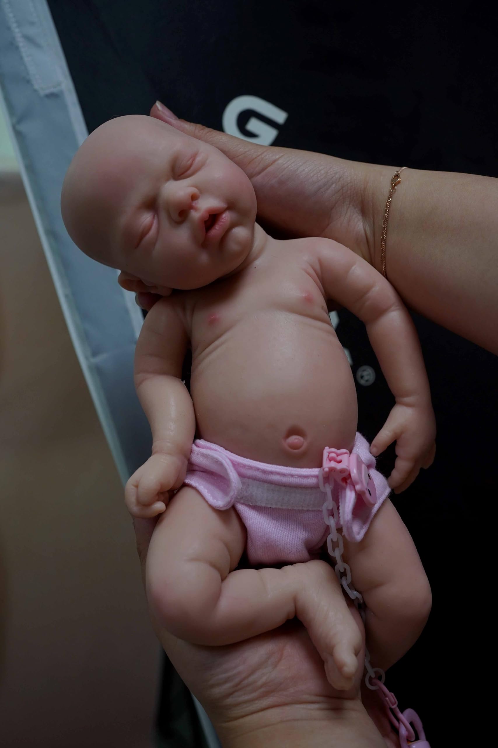 Close-up of MYREBABY silicone face with delicate features and soft texture.