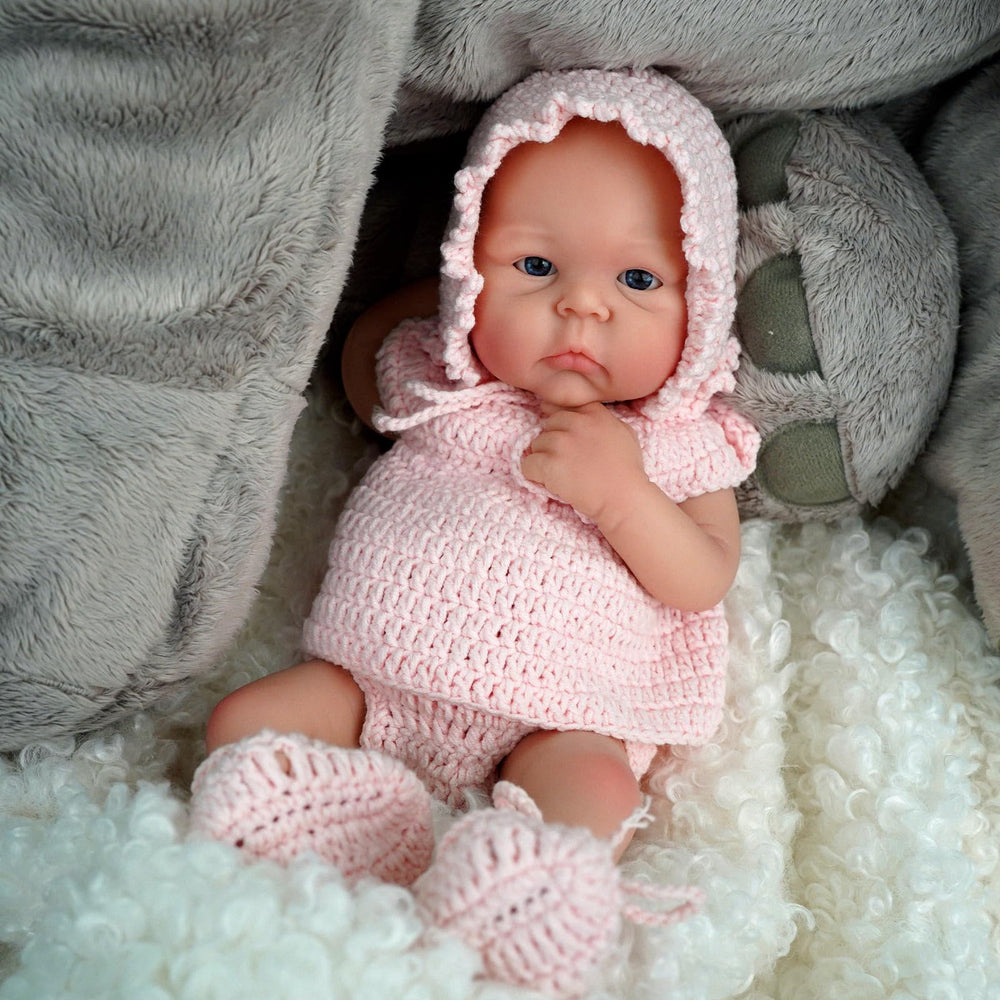 MYREBABY Carina doll with poseable limbs for natural sitting or resting poses.
