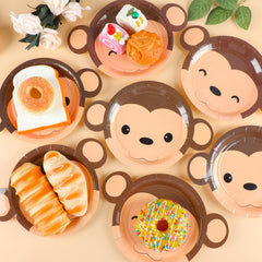 Naozinebi baby shower setup with monkey plates; festive mood created.