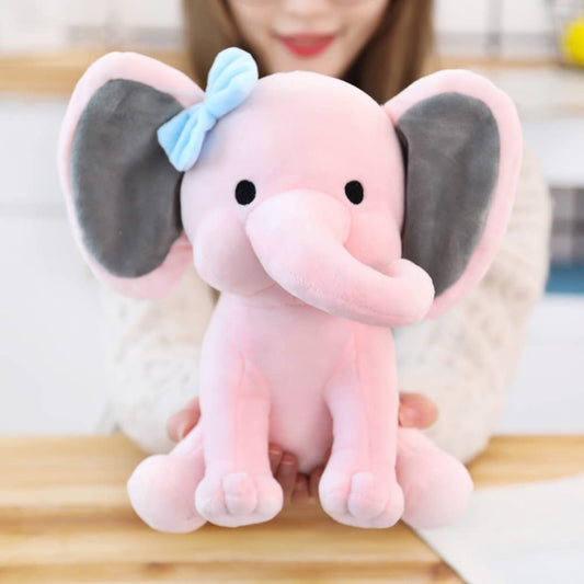 NatureMan elephant plush for nursery decor, adds soft color and whimsy to kids' rooms.