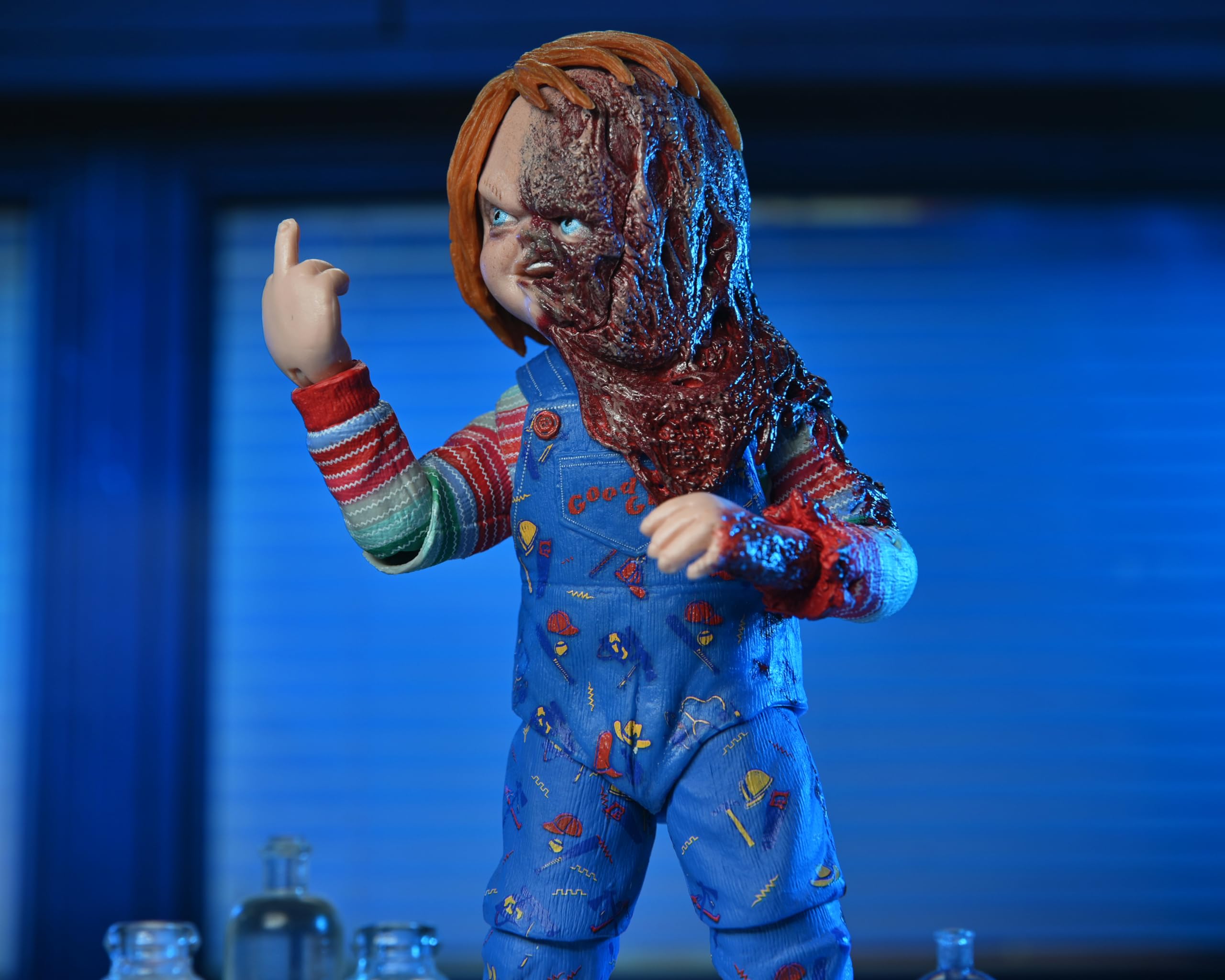 NECA Chucky burnt arm accessory for extra scene-specific customization.