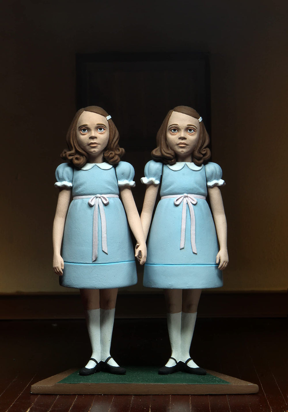 NECA Grady Twins blister packaging with the plus backdrop