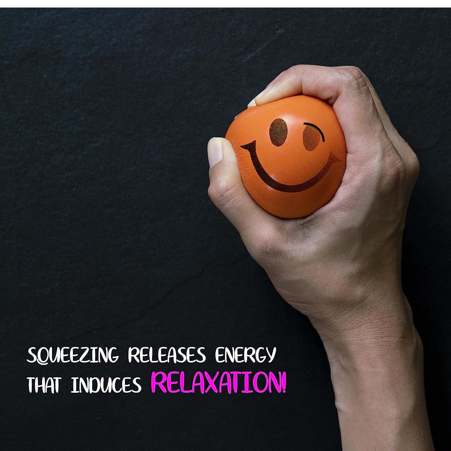 Neliblu Neon Smile stress ball with happy face on a desk setup for reset