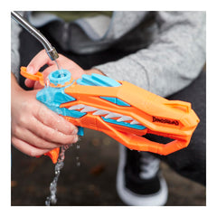 Nerf Dinosquad Raptor-Surge targeting a water-drenching stream on targets.