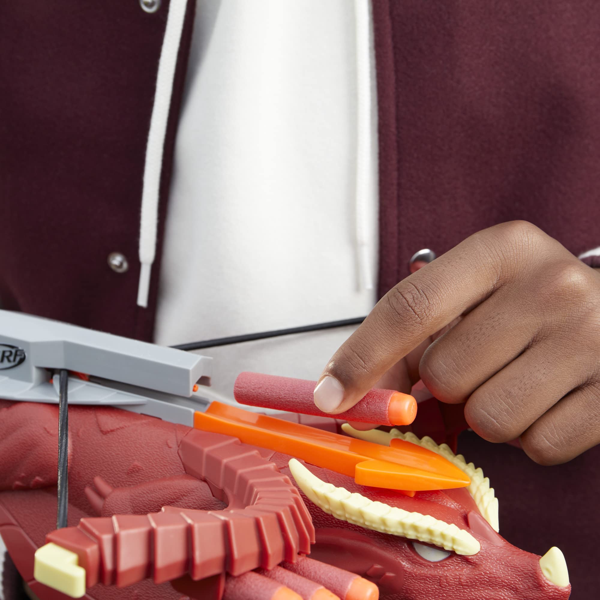 Nerf crossbow features red dragon styling for immersive role-play.