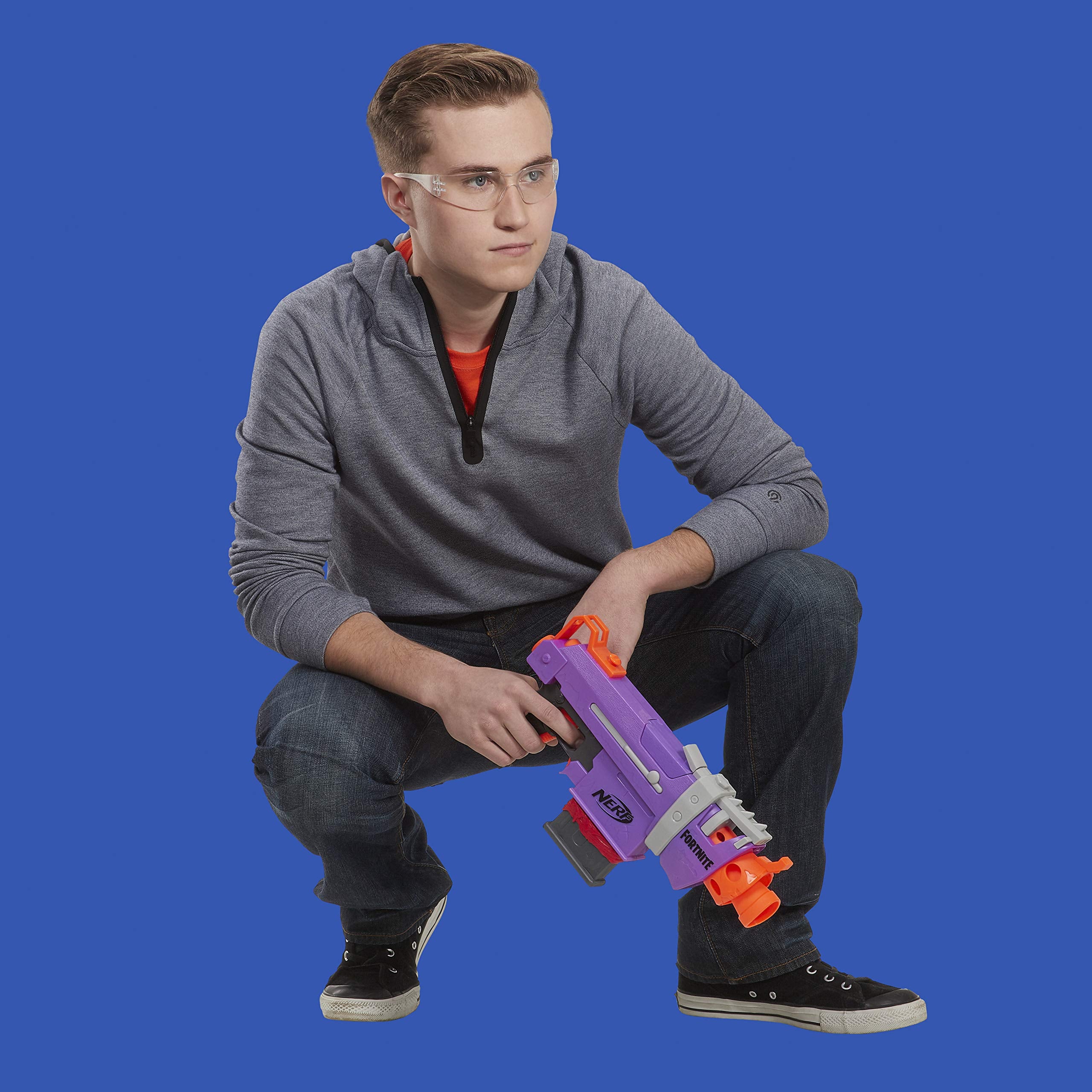 Nerf Fortnite SMG-E Blaster in a battle scene for team play.