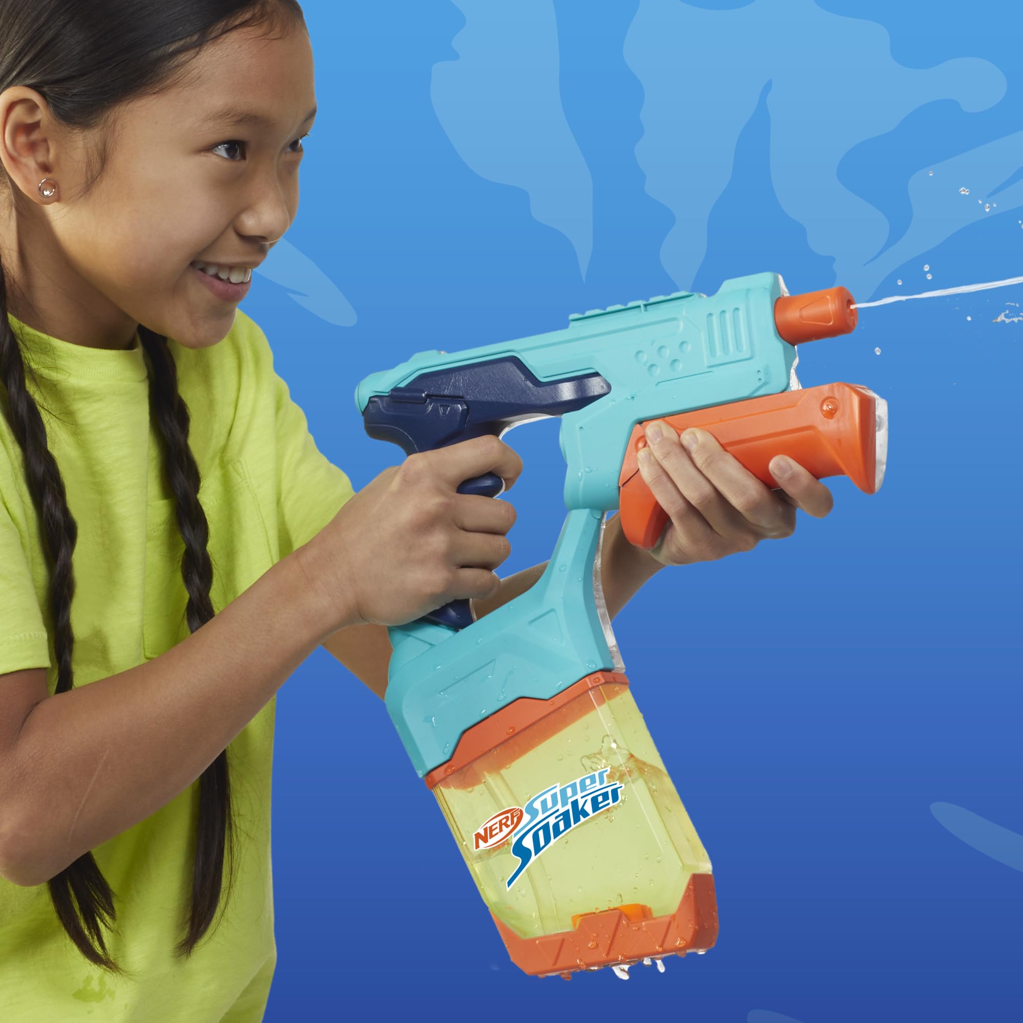 Backyard scene with two Nerf blasters on a sunny day.