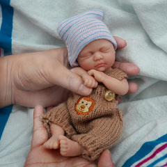Newtotlove baby boy doll wearing clothing set for dress-up and nurturing role-play.