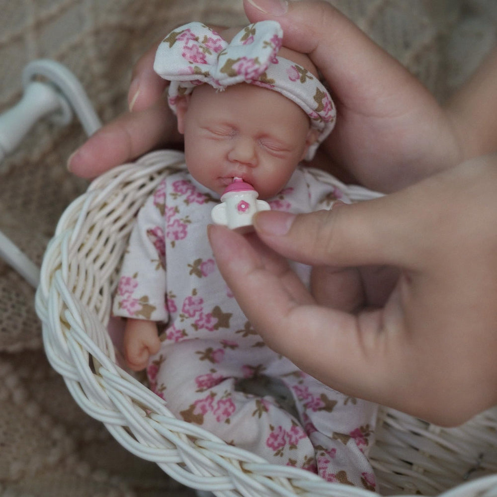 Newtotlove baby feeding bottle accessory supports nurturing interactions during playtime