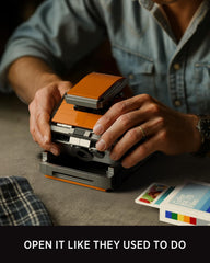 Nifeliz Plexoid BX-70 slide-out photo action adds playful nostalgia to shelves.